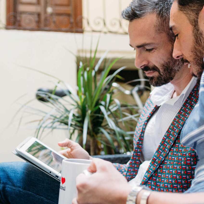 two-men-looking-at-phone